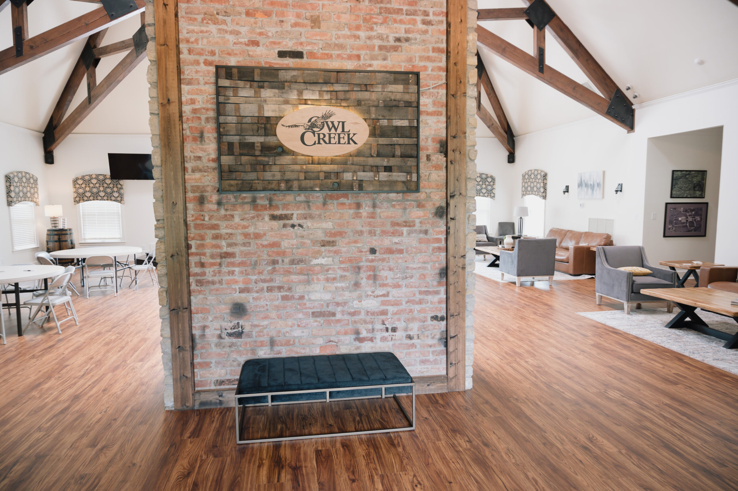 Business renovation including a brick wall and wood flooring
